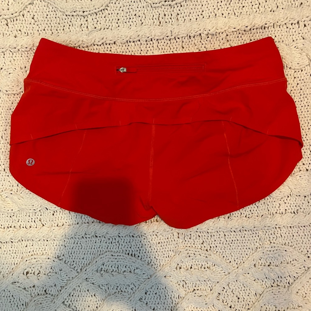 Lululemon, size 6, 2.5” speed up shorts in red.